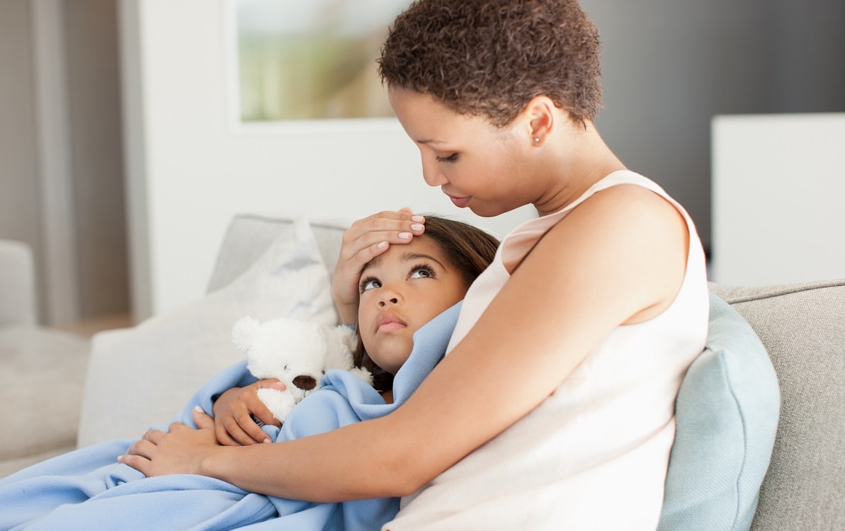 Mother taking care of her daughter suffering from dehydration by way of some electrolytes
